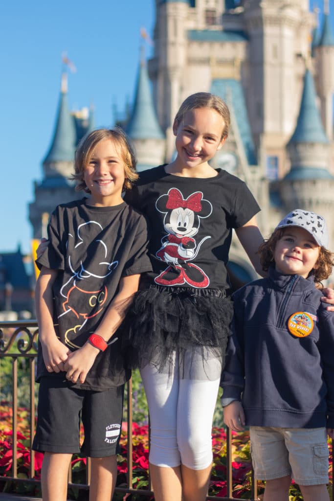 three kids at Disney in December