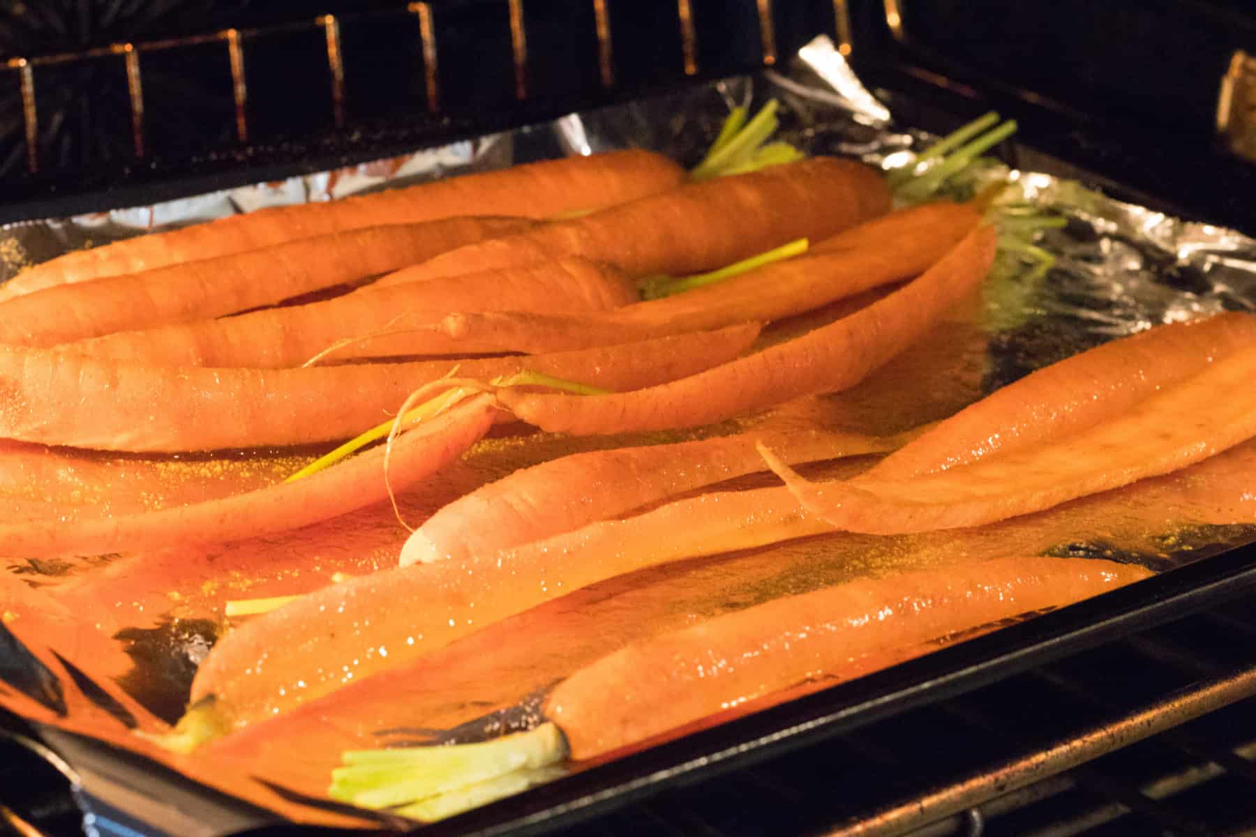carrots sliced on a roasting pan